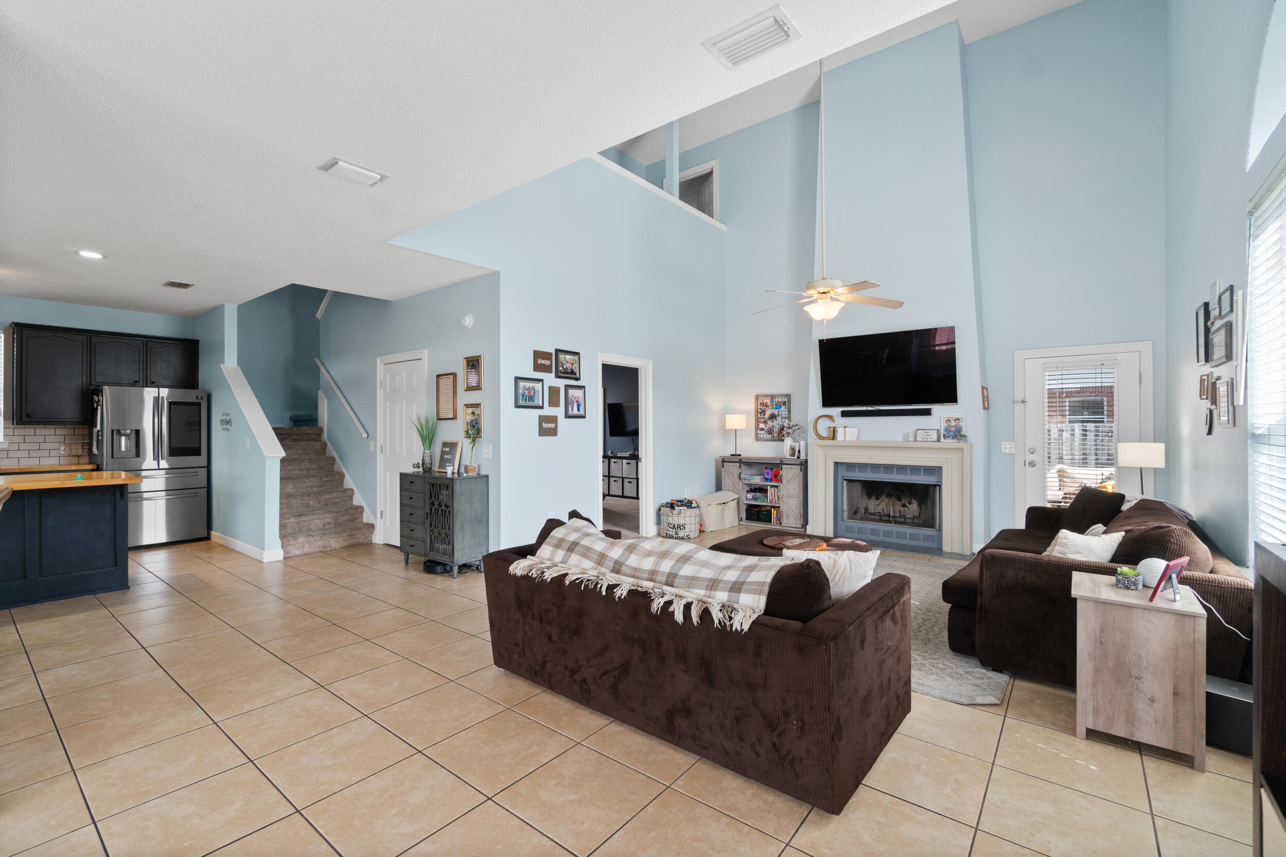 31 Corte Lago Santa Rosa Beach, FL 32459 - Photo 4 of 42 a living room with furniture a fireplace and a flat screen tv