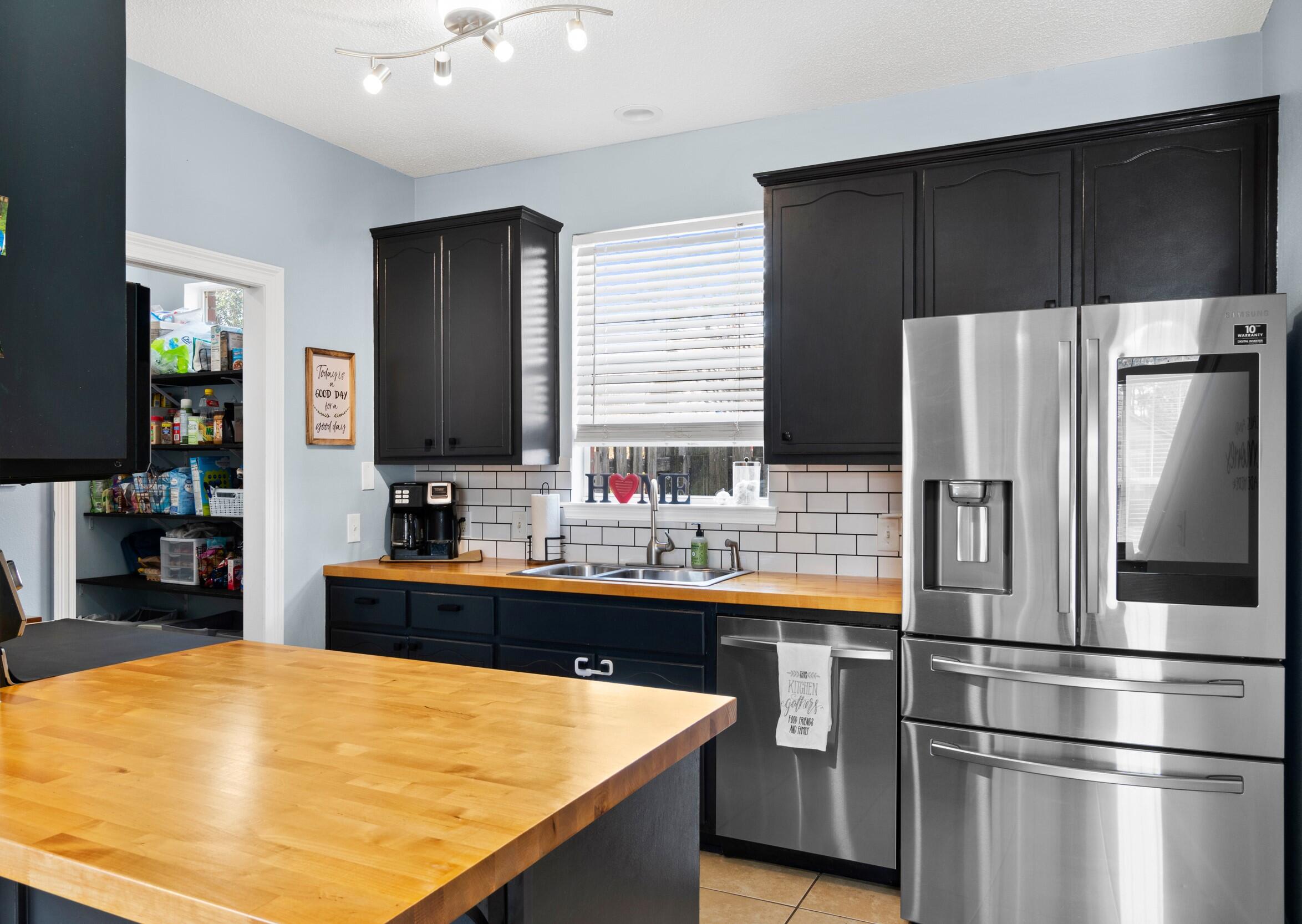 31 Corte Lago Santa Rosa Beach, FL 32459 - Photo 5 of 42 a kitchen with stainless steel appliances a refrigerator and a stove