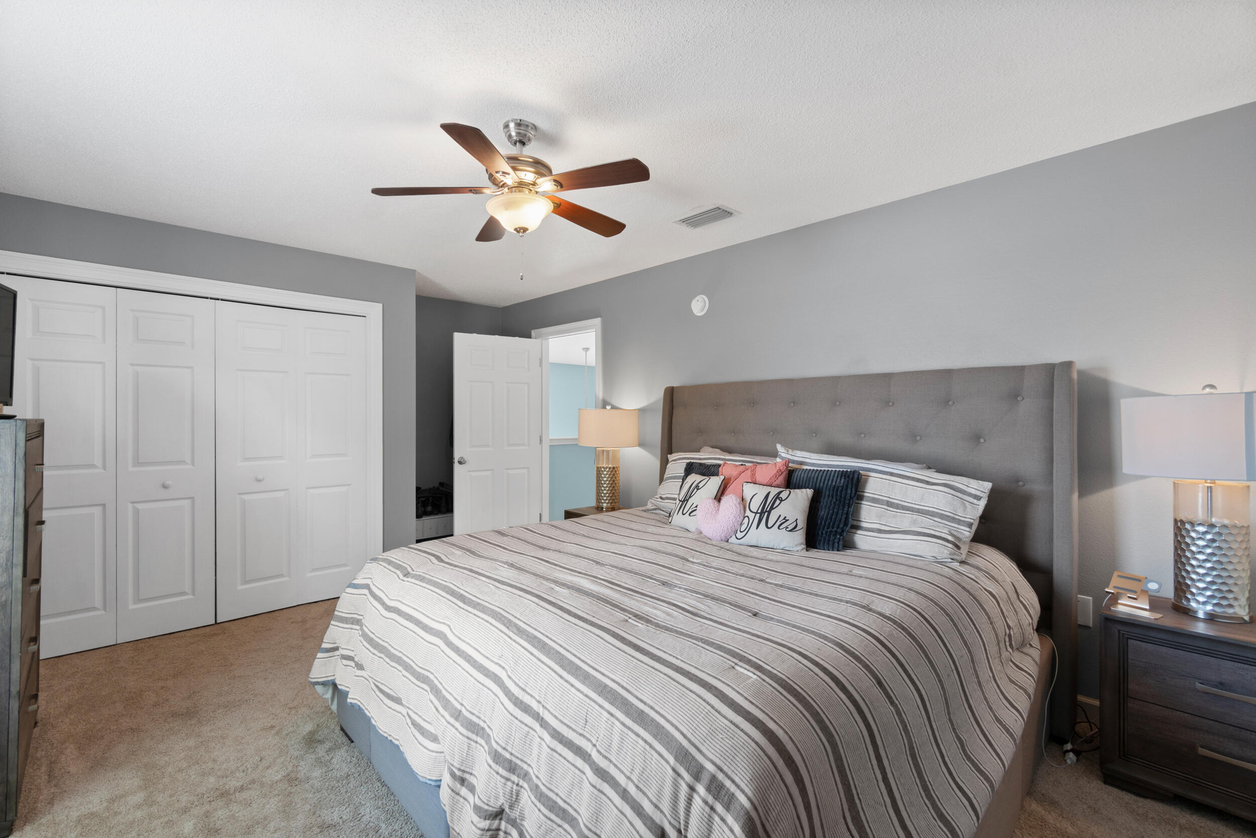 31 Corte Lago Santa Rosa Beach, FL 32459 - Photo 9 of 42 a bedroom with a large bed and a chandelier