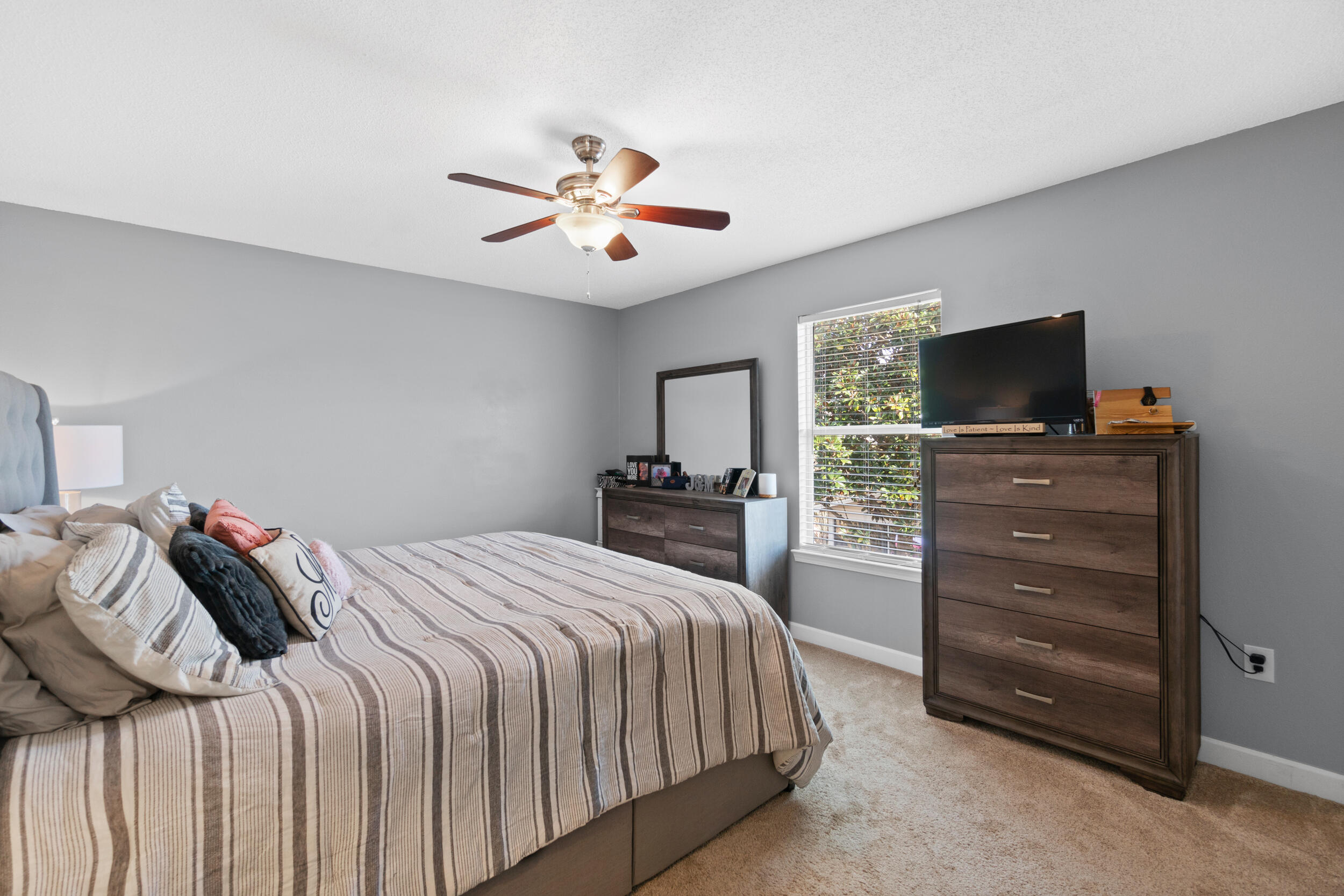 31 Corte Lago Santa Rosa Beach, FL 32459 - Photo 10 of 42 a bedroom with a bed and a flat tv screen on dresser