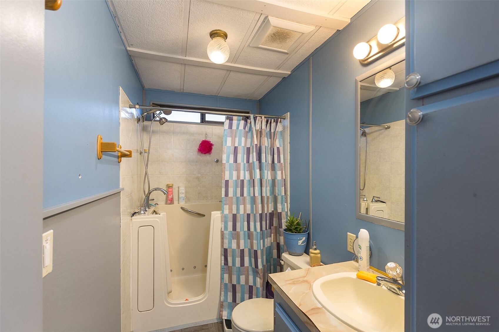 501 McCarver Road Port Angeles, WA 98362 - Photo 15 of 36 a bathroom with a sink toilet and shower