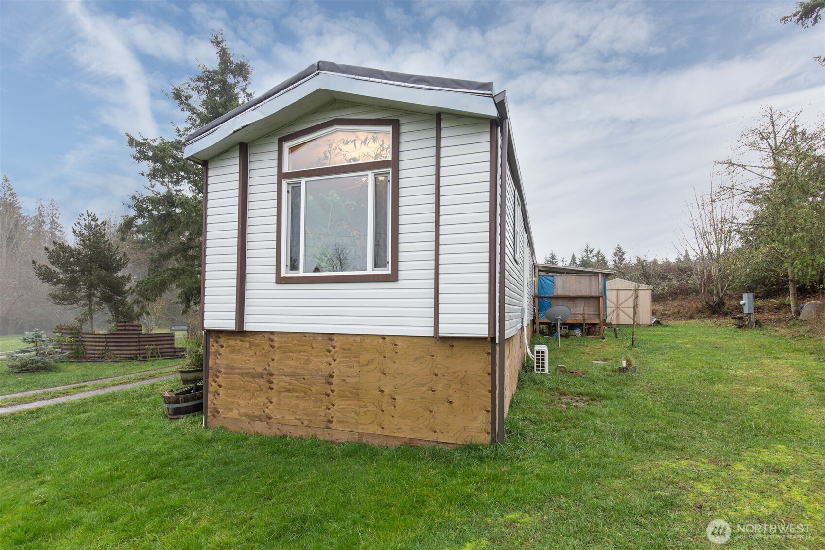 501 McCarver Road Port Angeles, WA 98362 - Photo 18 of 36 a view of a house with a yard