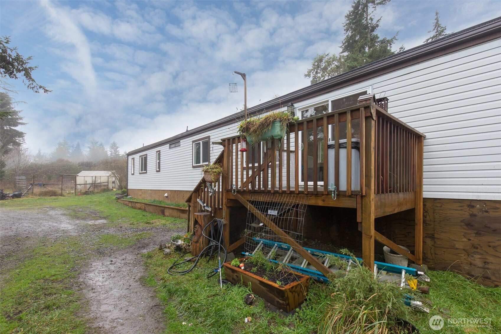 501 McCarver Road Port Angeles, WA 98362 - Photo 20 of 36 a view of a house with backyard and sitting area