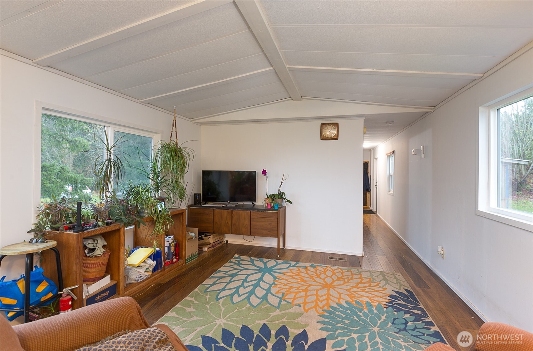 501 McCarver Road Port Angeles, WA 98362 - Photo 2 of 36 a living room with furniture and a flat screen tv