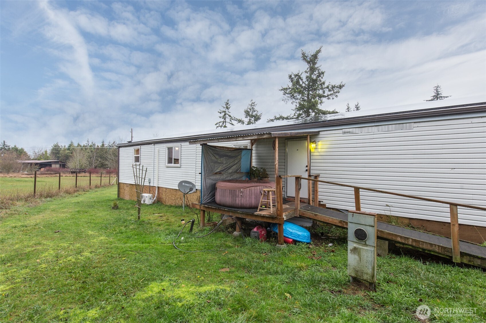 501 McCarver Road Port Angeles, WA 98362 - Photo 21 of 36 a view of a house with a backyard and chairs