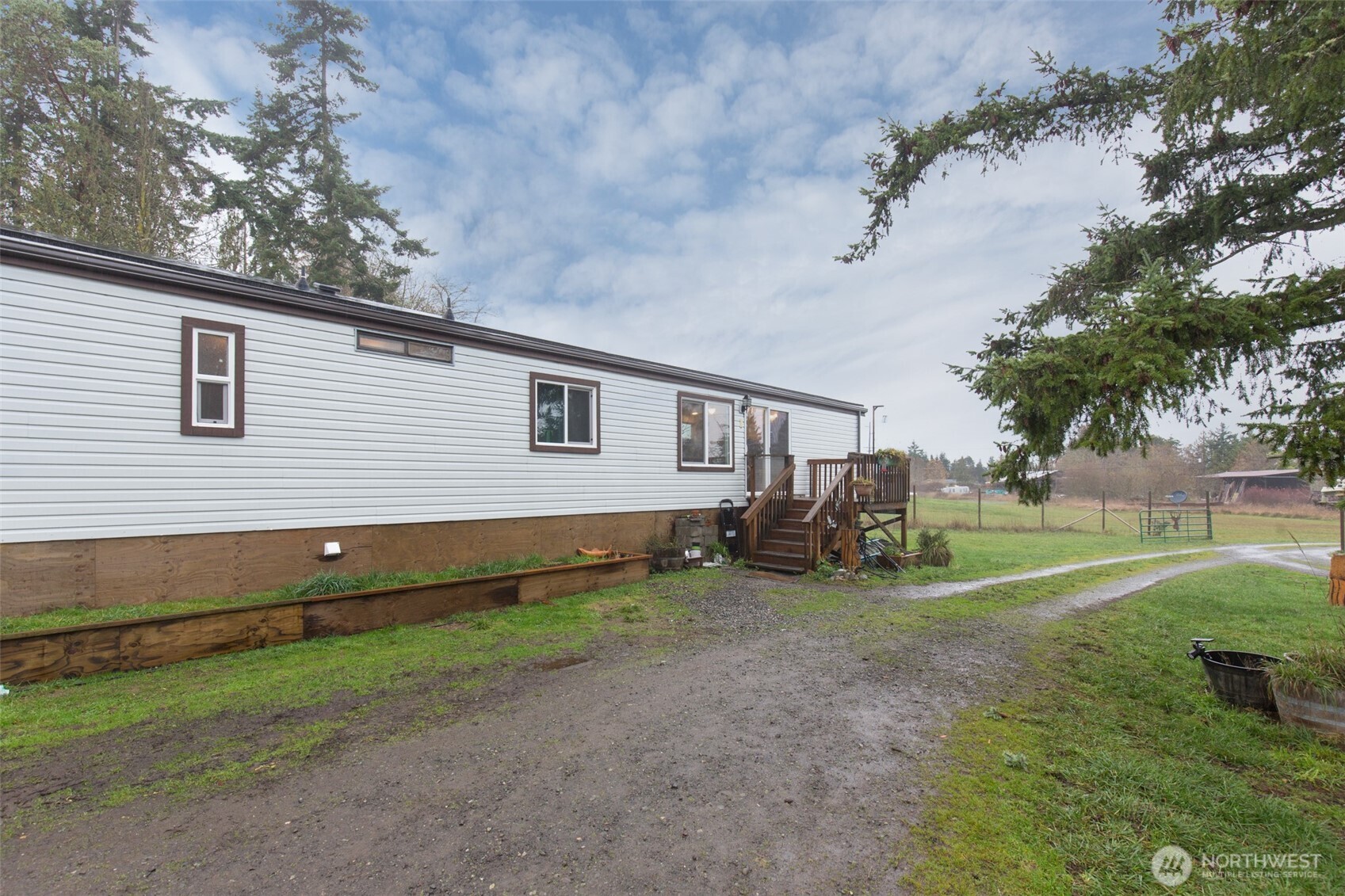 501 McCarver Road Port Angeles, WA 98362 - Photo 25 of 36 a view of a house with a back yard