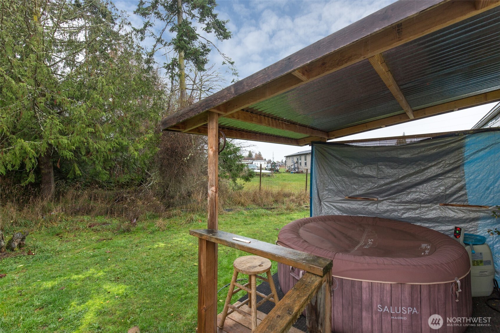 501 McCarver Road Port Angeles, WA 98362 - Photo 27 of 36 a view of a patio with table and chairs under an umbrella