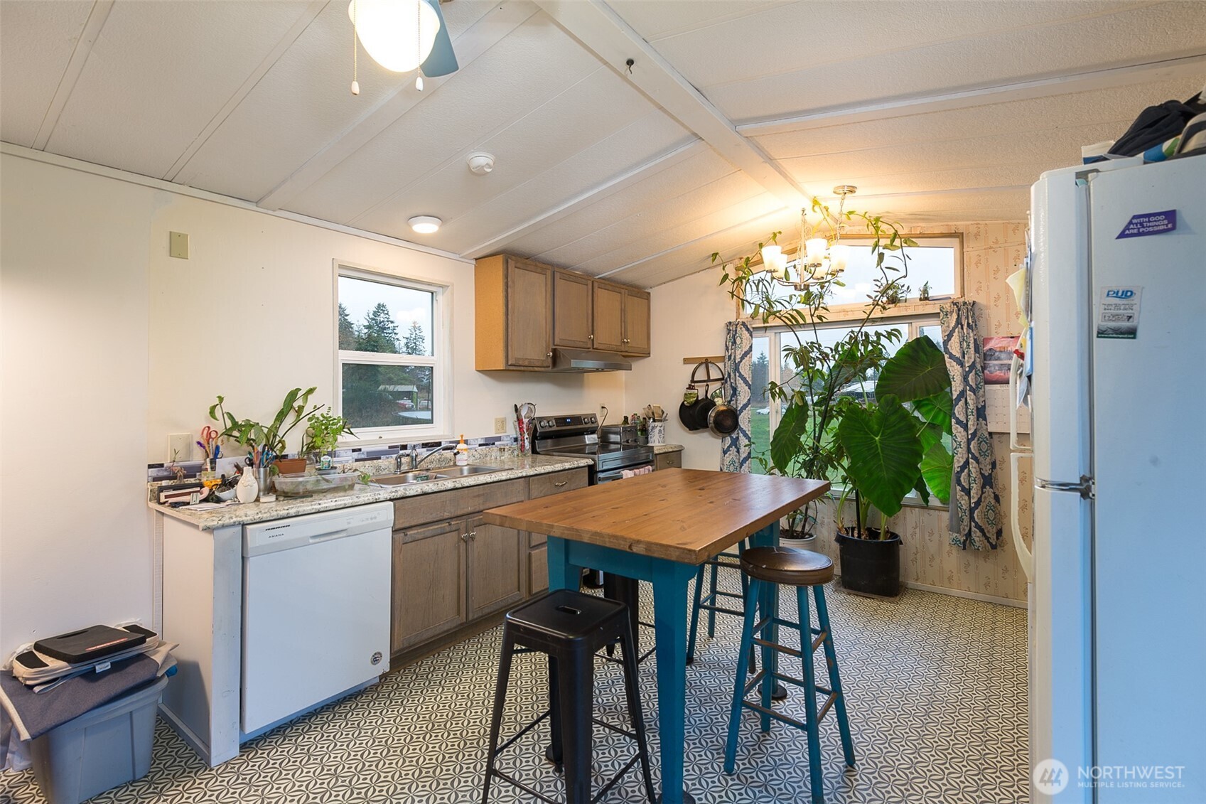 501 McCarver Road Port Angeles, WA 98362 - Photo 5 of 36 a kitchen with a table and chairs in it