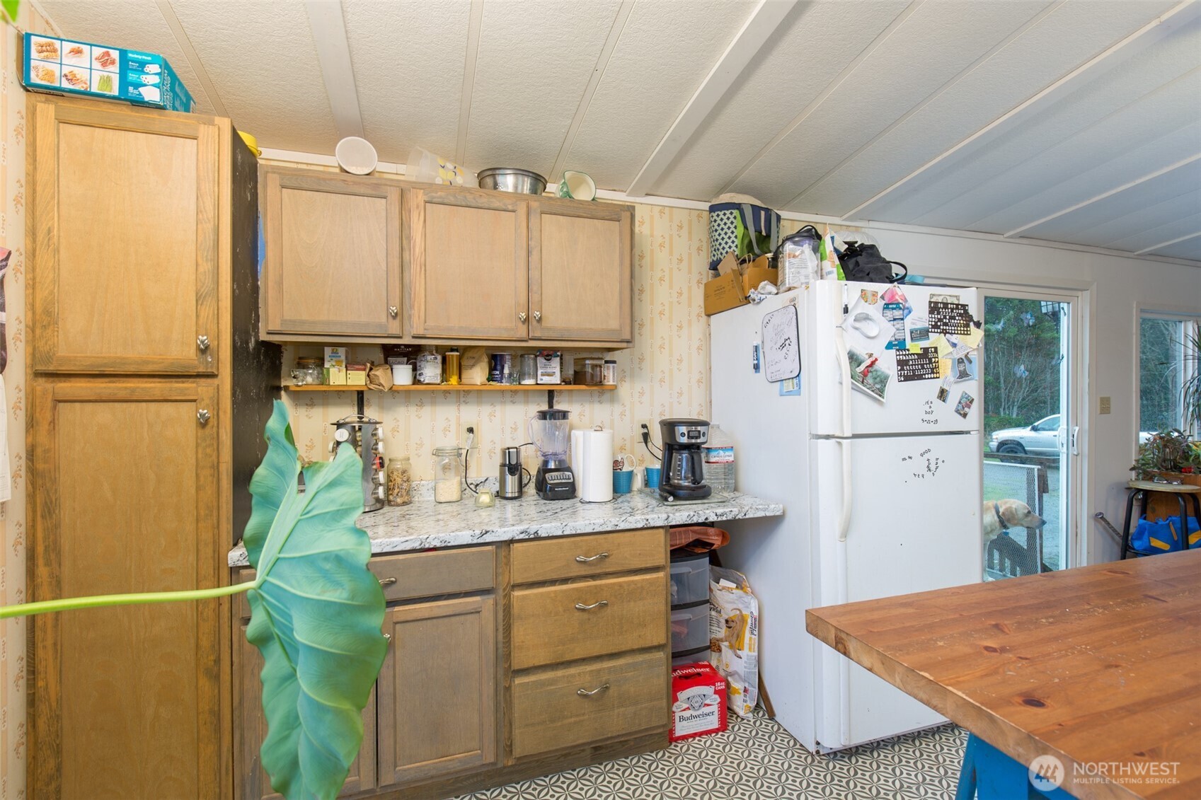501 McCarver Road Port Angeles, WA 98362 - Photo 6 of 36 a kitchen with a refrigerator a stove a sink dishwasher and wooden cabinets
