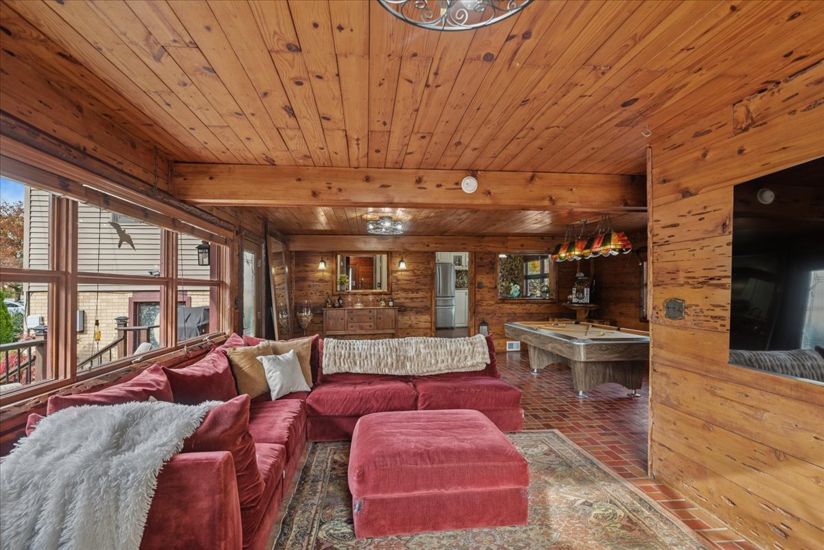 2813 Theresa Avenue Waukegan, IL 60085 - Photo 13 of 23 a living room with furniture a fireplace and a flat screen tv