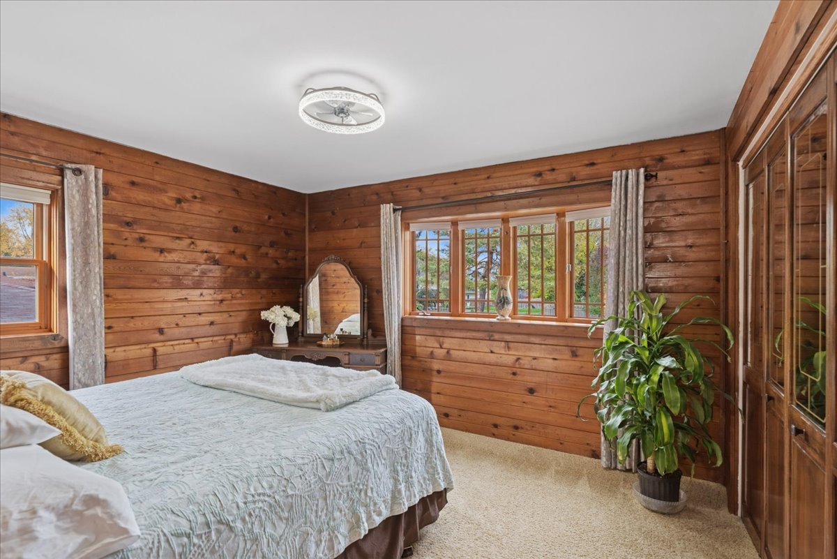 2813 Theresa Avenue Waukegan, IL 60085 - Photo 15 of 23 a bedroom with a bed and a potted plant