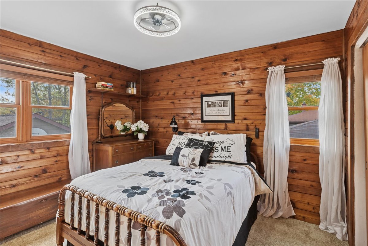 2813 Theresa Avenue Waukegan, IL 60085 - Photo 17 of 23 a bed sitting in a bedroom next to a window