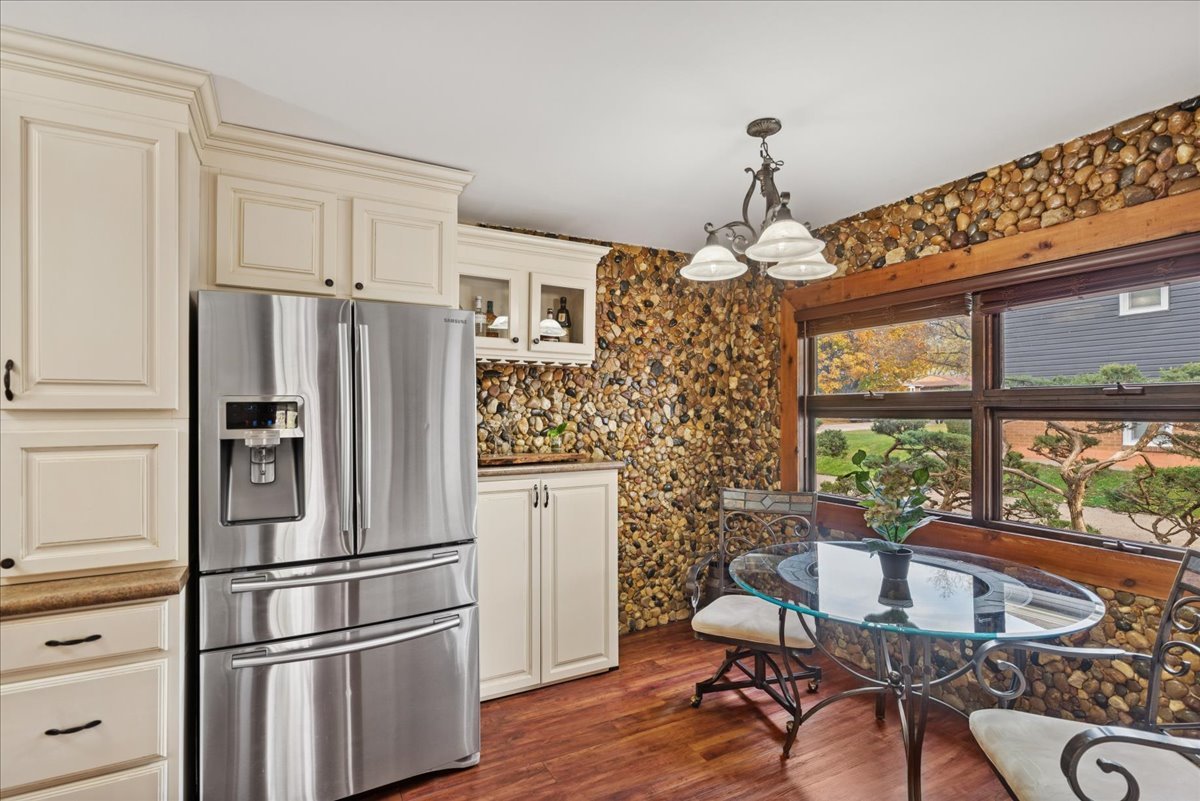 2813 Theresa Avenue Waukegan, IL 60085 - Photo 7 of 23 a kitchen with stainless steel appliances granite countertop a refrigerator and a stove top oven