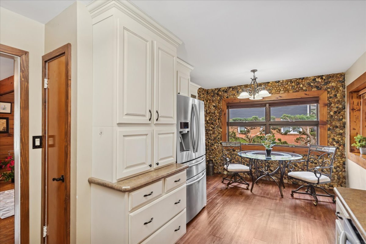 2813 Theresa Avenue Waukegan, IL 60085 - Photo 8 of 23 a view of a kitchen with furniture and wooden floor