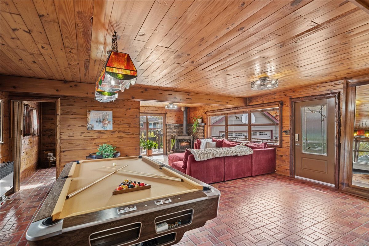 2813 Theresa Avenue Waukegan, IL 60085 - Photo 10 of 23 a living room with furniture a flat screen tv and windows