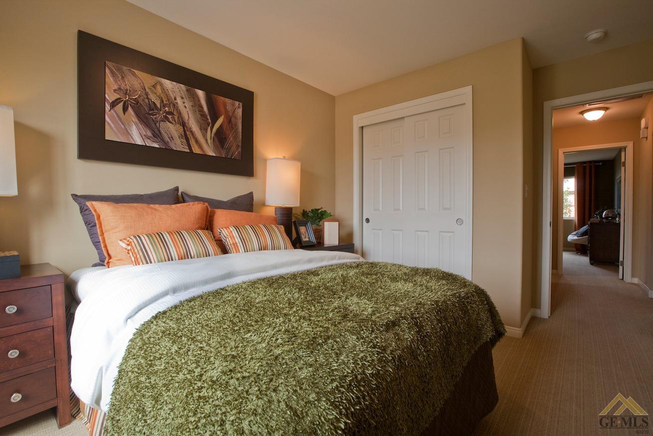 Undisclosed Address Bakersfield, CA 93313 - Photo 2 of 5 a bedroom with a bed and a painting on the wall