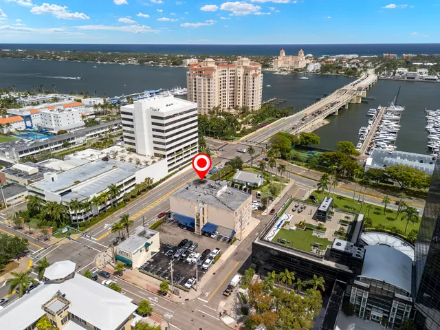a front view of a building with parking space