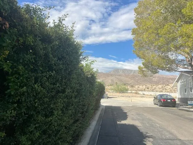 a view of a city street with a building