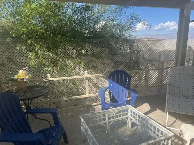 a view of balcony with furniture