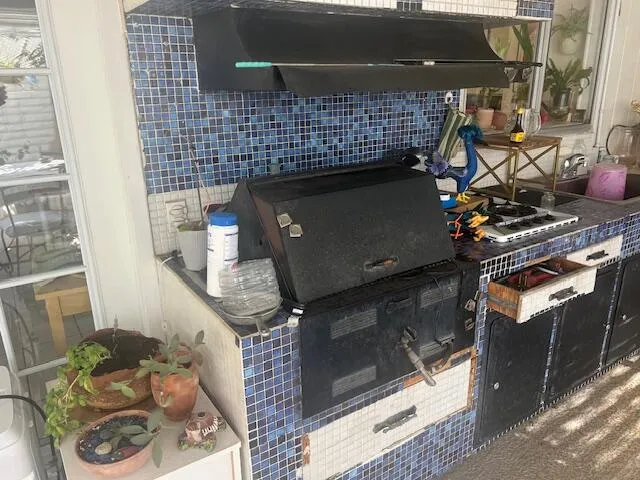 a view of a porch with a table and chairs