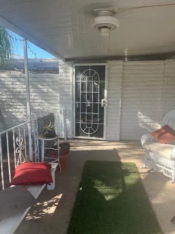a view of balcony with furniture