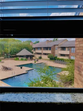 a view of swimming pool with a yard