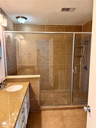 a bathroom with a shower and a tub