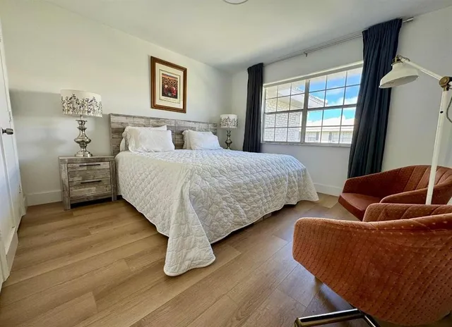 a bedroom with two beds and a couch