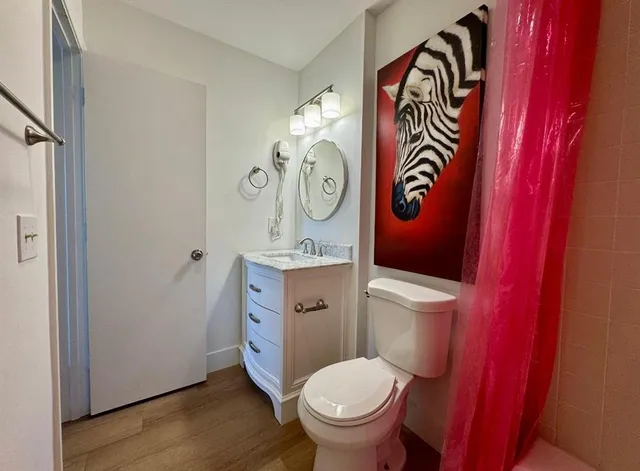 a bathroom with a toilet and a sink