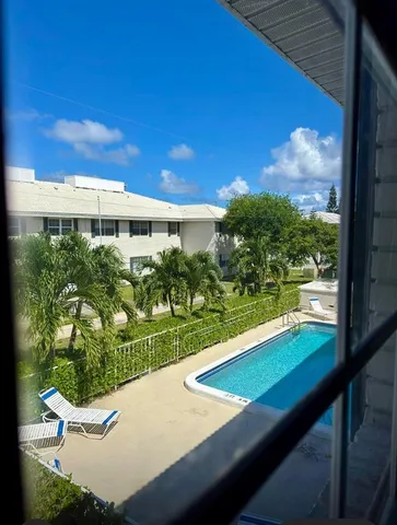 a view of swimming pool from a balcony