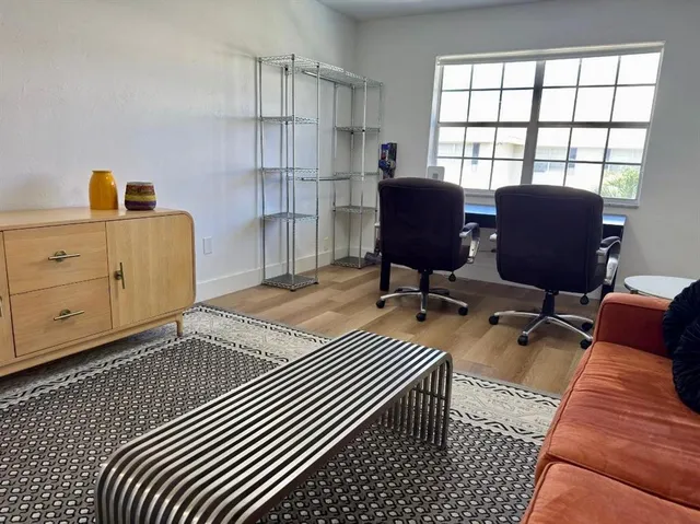 a workspace with furniture and window