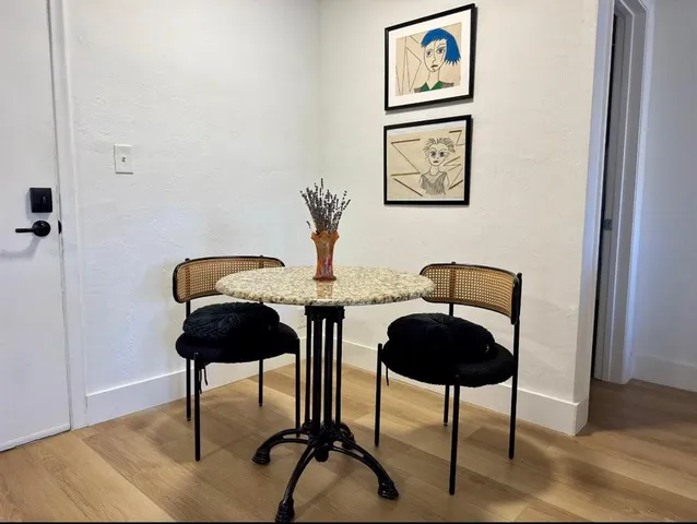 a lamp on a table and a potted plant sitting on a table