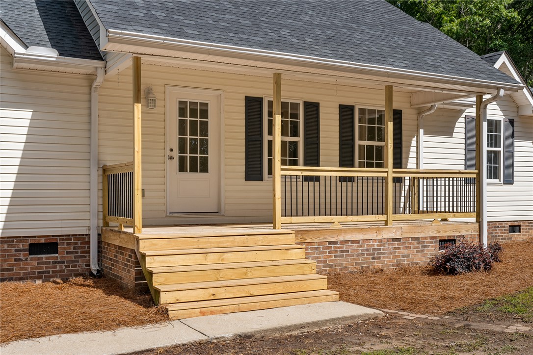 131 Lockaby Road Pelzer, SC 29669 - Photo 10 of 50 This inviting home features a charming covered porch and durable vinyl siding.