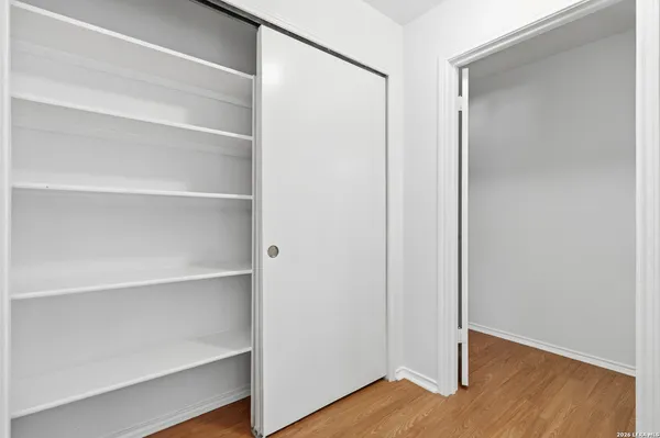 a view of an empty walk in closet