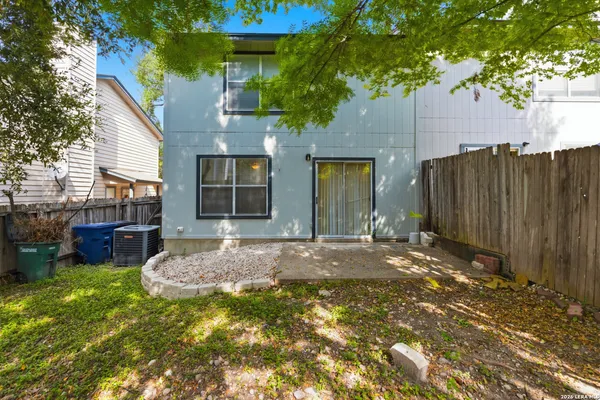 a backyard of a house with seating space