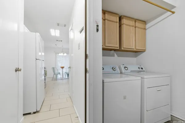 a view of a kitchen with electric appliances
