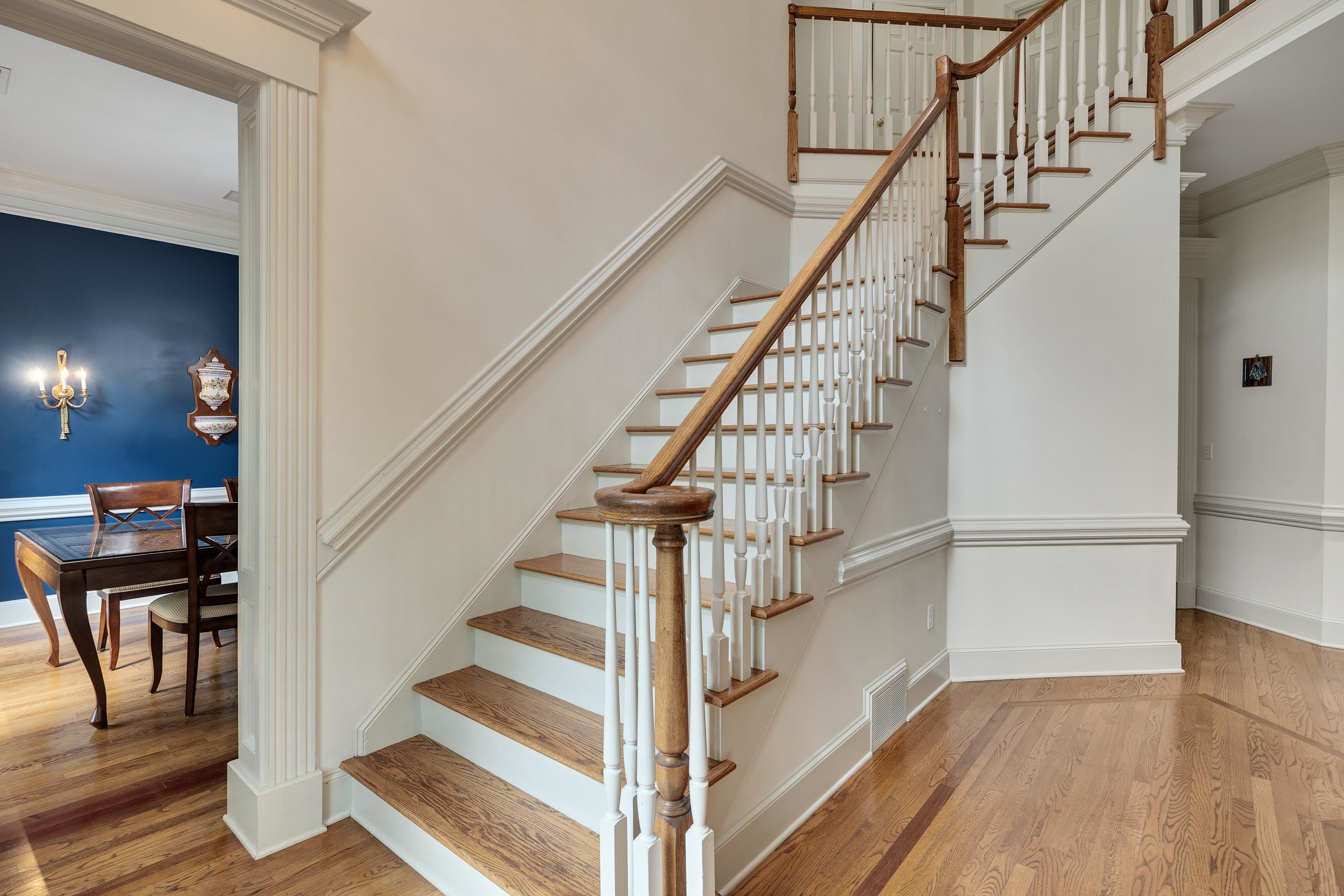 350 Bluff Ridge Cove Memphis, TN 38018 - Photo 12 of 37 Hardwood staircase featuring white risers and natural wood treads