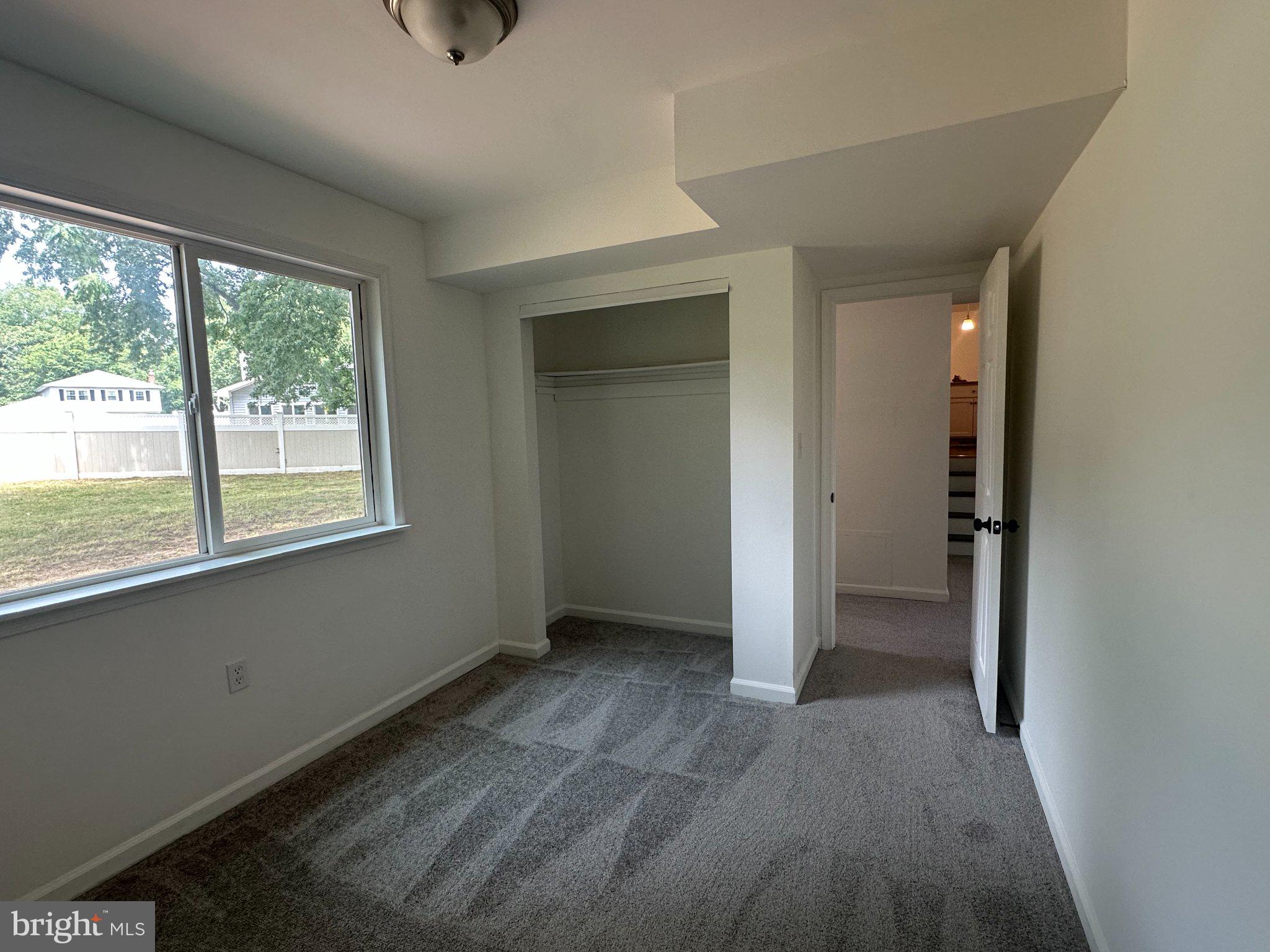 6 Travertine Way Newark, DE 19702 - Photo 5 of 22 wooden floor and window in an empty room
