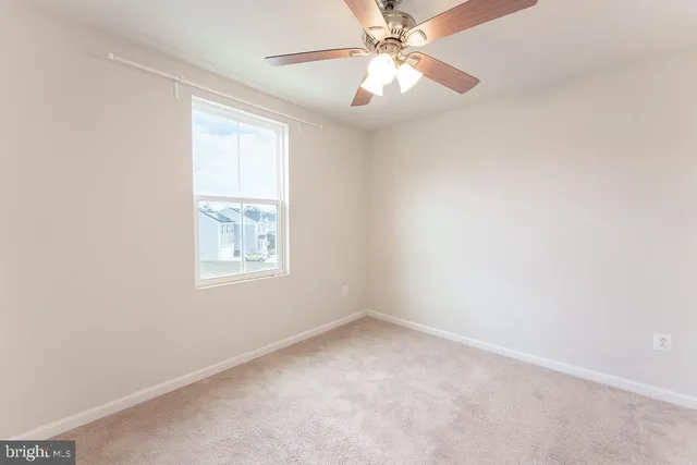 a view of hallway with wooden floor