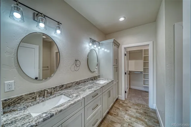 an empty room with a window and a ceiling fan