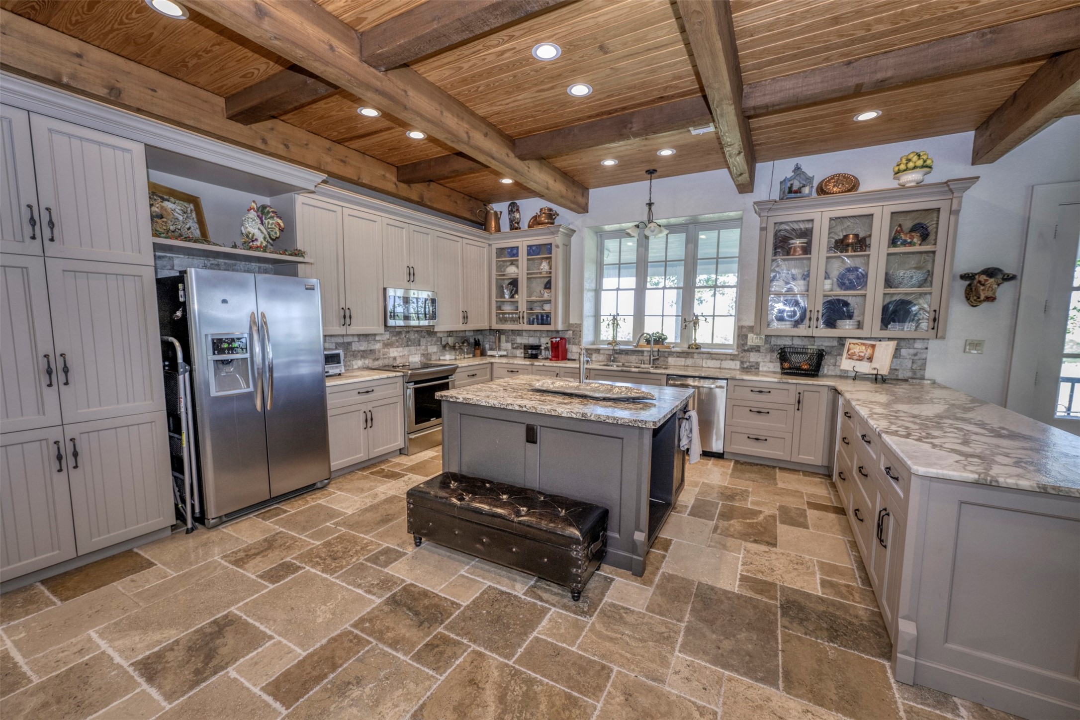 1711 Sempronius Road Chappell Hill, TX 77426 - Photo 13 of 50 a kitchen with a sink stove and refrigerator