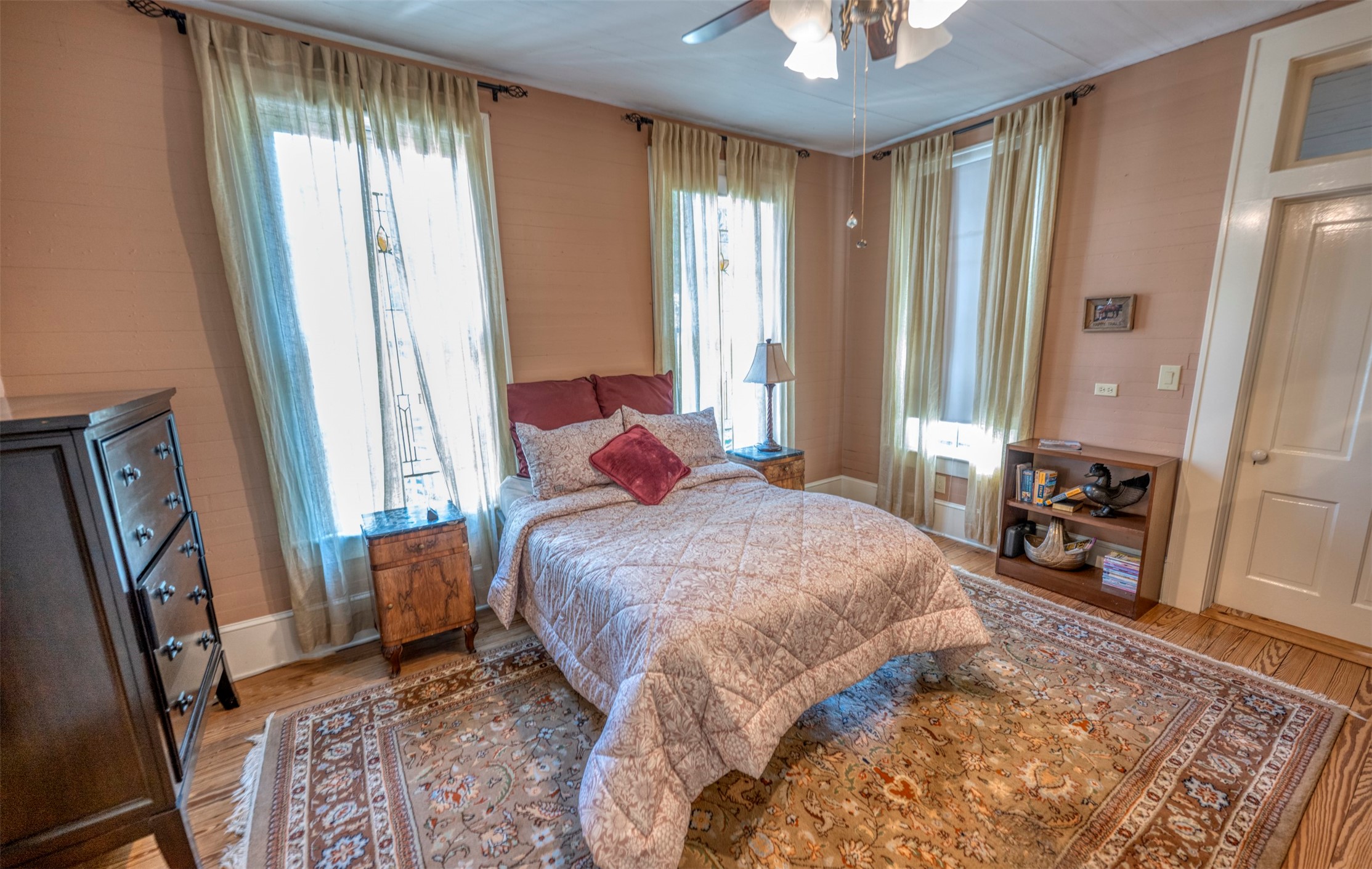 1711 Sempronius Road Chappell Hill, TX 77426 - Photo 16 of 50 a bedroom with a bed and a chandelier