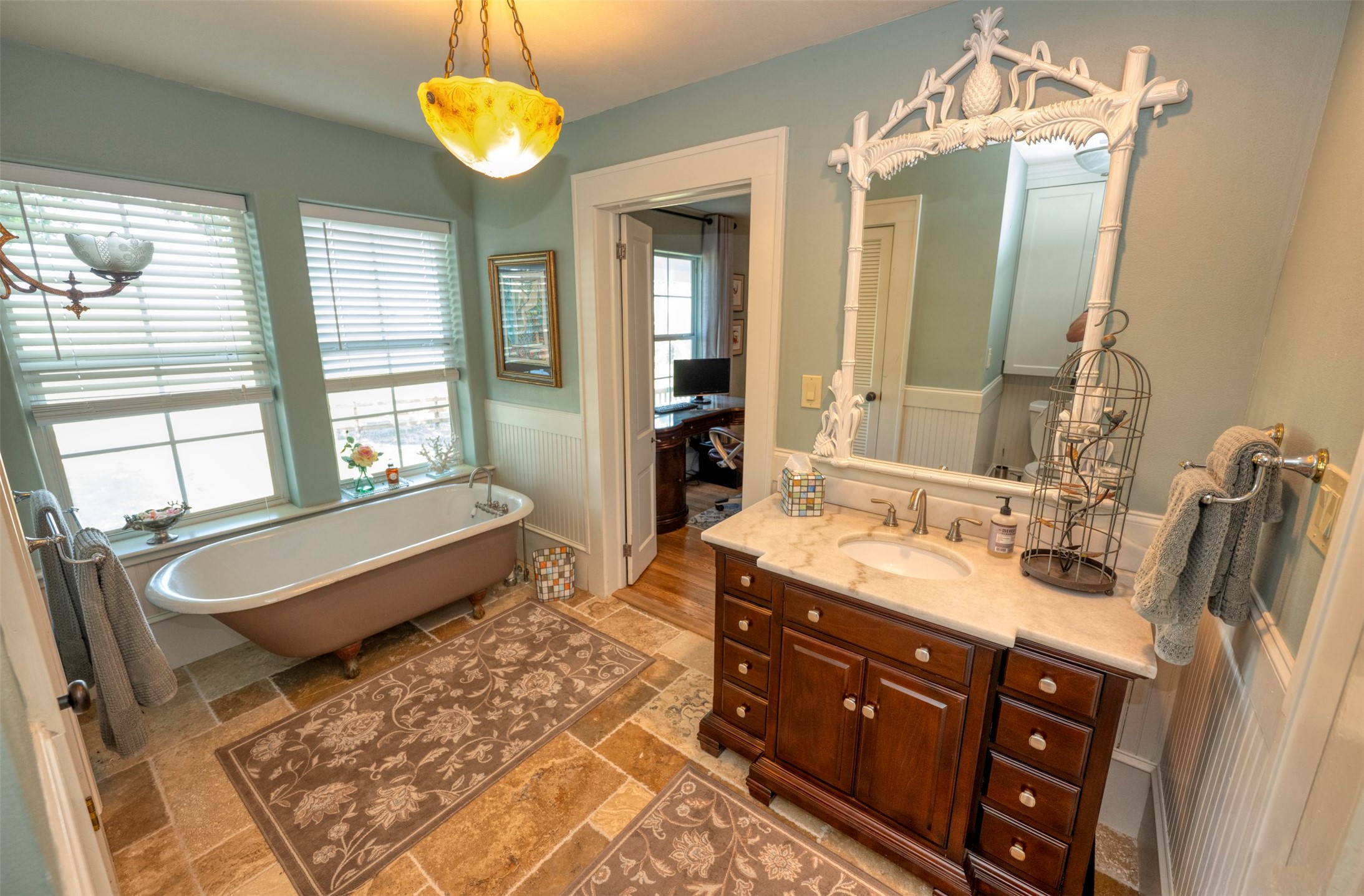1711 Sempronius Road Chappell Hill, TX 77426 - Photo 17 of 50 a bathroom with a double vanity sink and a bathtub