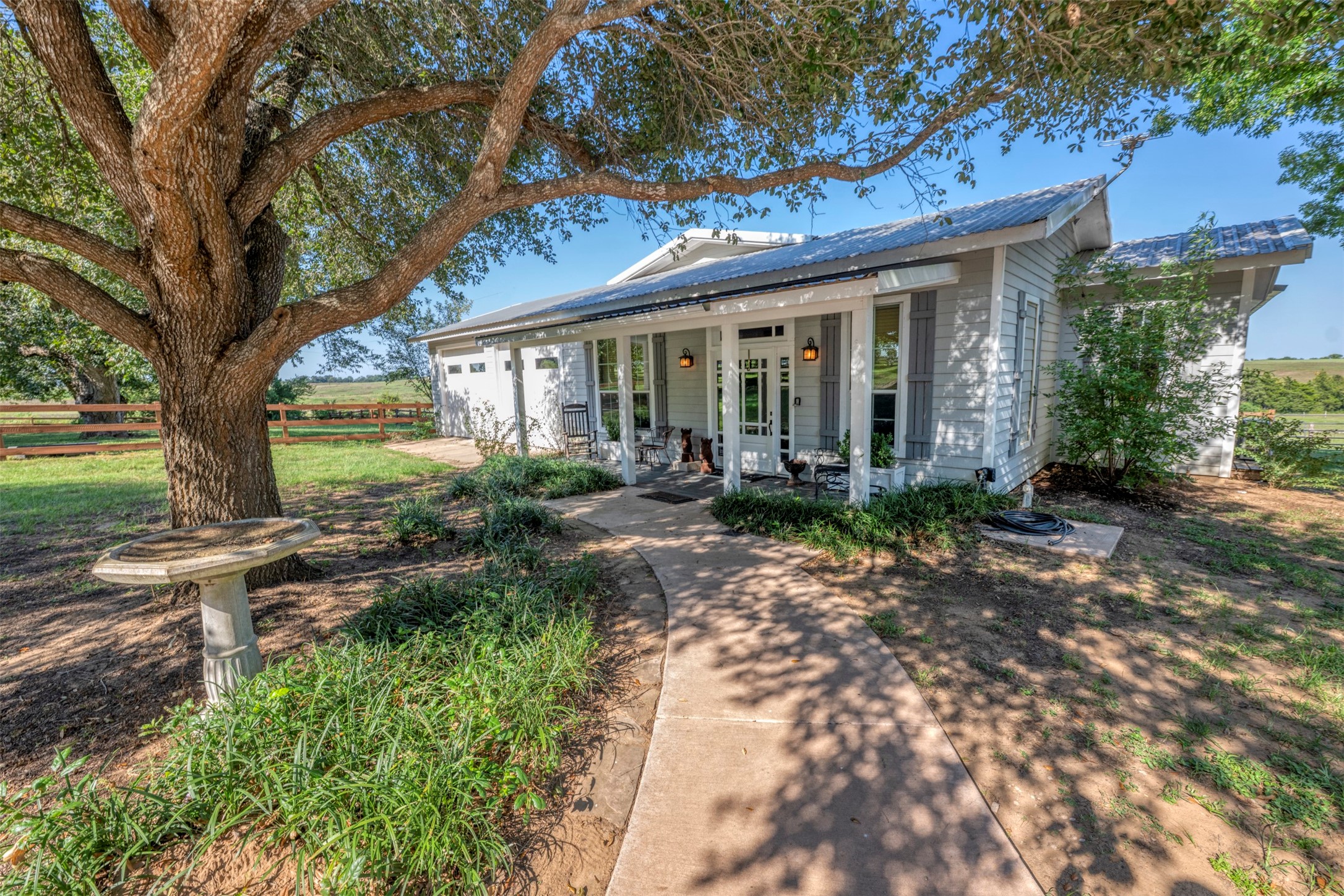 1711 Sempronius Road Chappell Hill, TX 77426 - Photo 29 of 50 a front view of house with a garden
