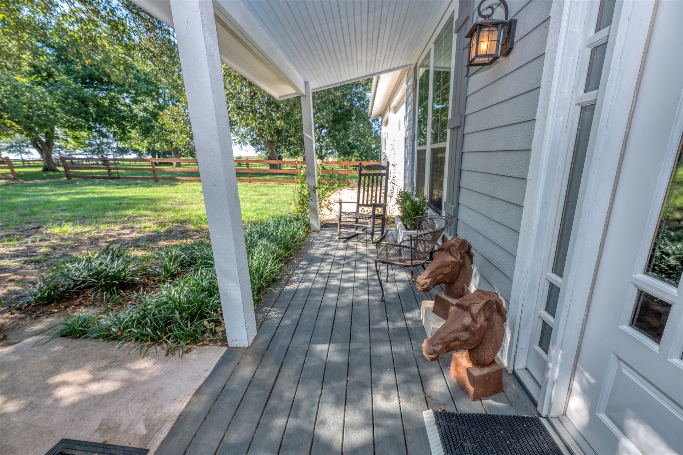 1711 Sempronius Road Chappell Hill, TX 77426 - Photo 32 of 50 a view of a porch with wooden floor