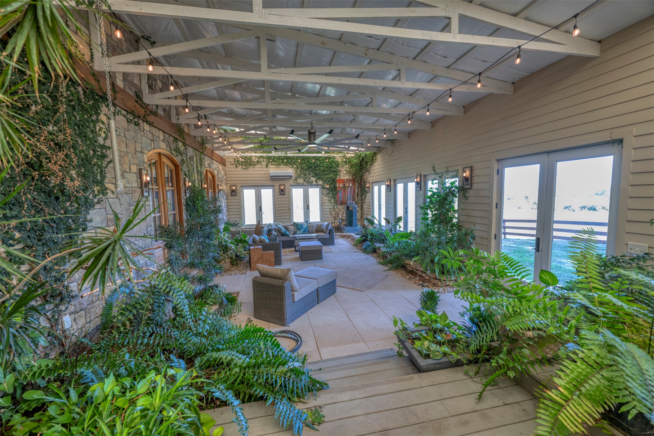 1711 Sempronius Road Chappell Hill, TX 77426 - Photo 41 of 50 a view of a patio with plants and chairs