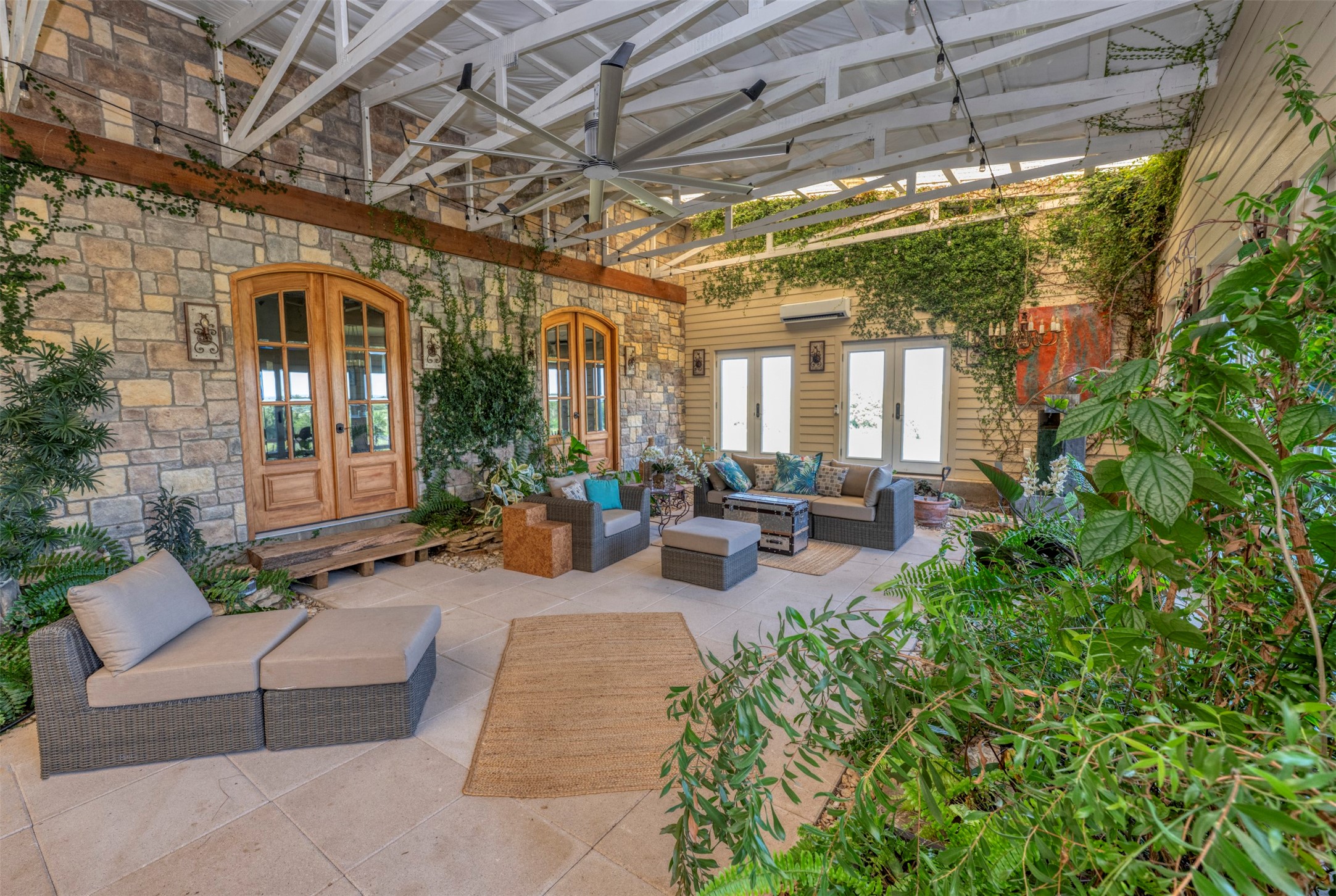 1711 Sempronius Road Chappell Hill, TX 77426 - Photo 42 of 50 a view of a patio with couches and potted plants