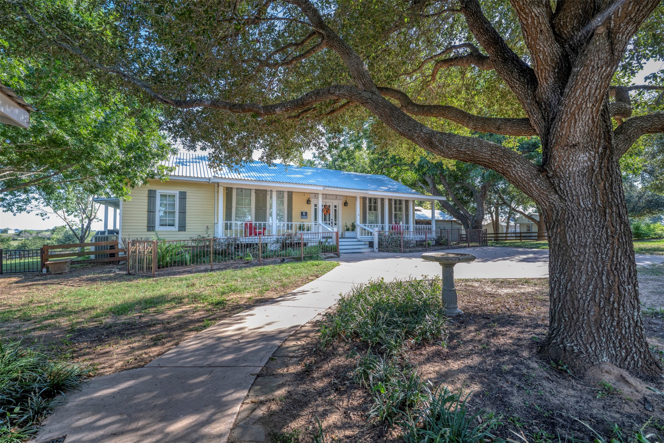 1711 Sempronius Road Chappell Hill, TX 77426 - Photo 6 of 50 a house view with a garden space
