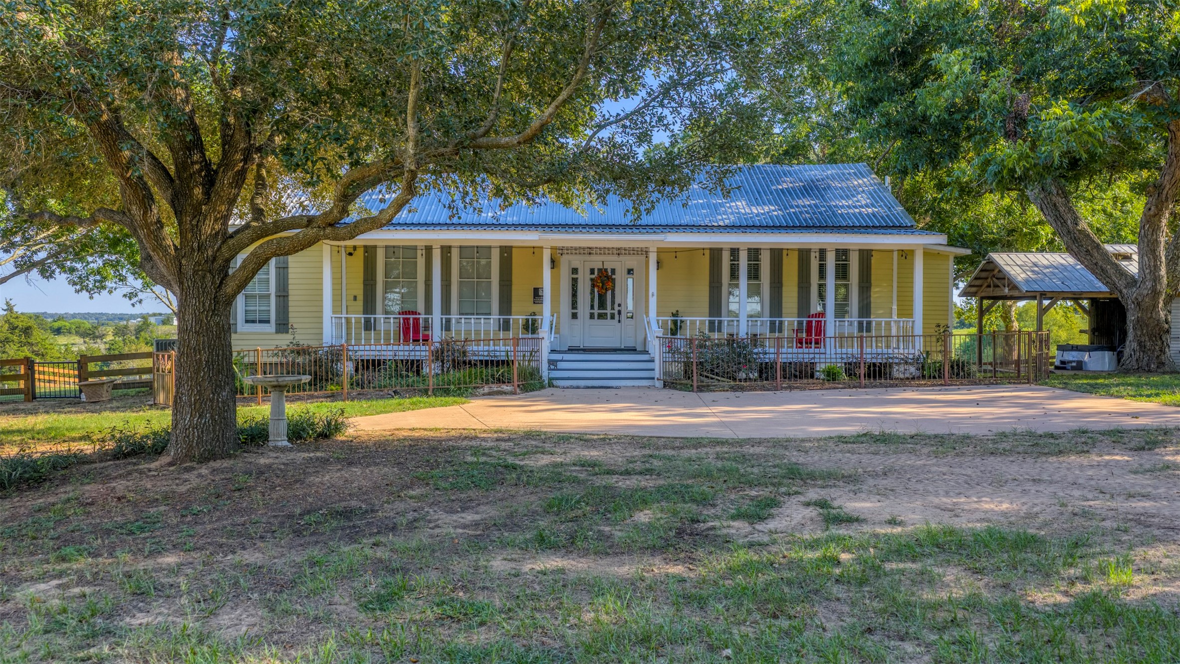 1711 Sempronius Road Chappell Hill, TX 77426 - Photo 7 of 50 a front view of a house with garden