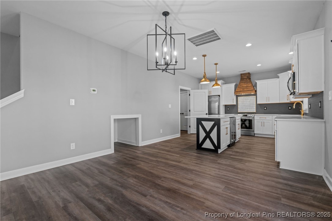 314 Persimmon Tree Drive Cameron, NC 28326 - Photo 13 of 46 a view of a kitchen and dining room